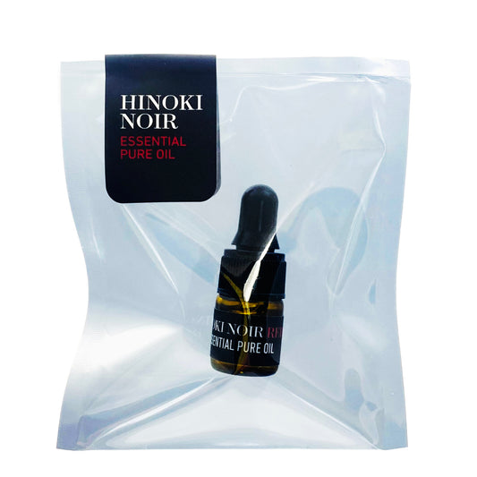 Hinoki Noir essential pure oil bottle with dropper in clear packaging on a white background