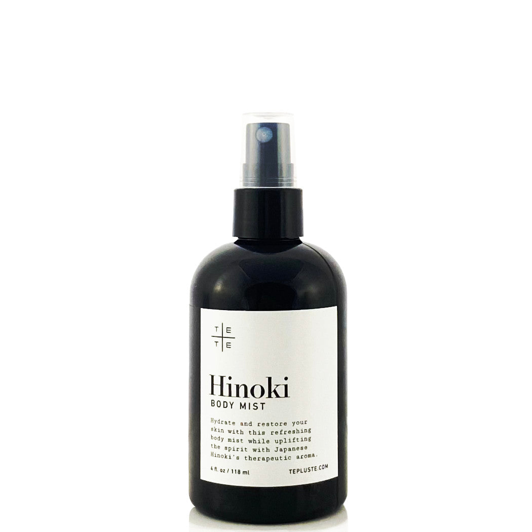 black spray mist bottle with labeled Hinoki Body Mist in white background