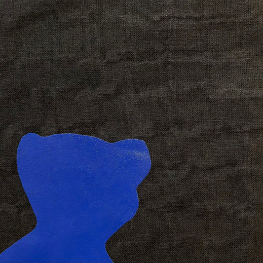 Close-up of Black tote bag with blue bear shaped motif designed by Danish mixed media artist Per Skovgaard Based in Copenhagen