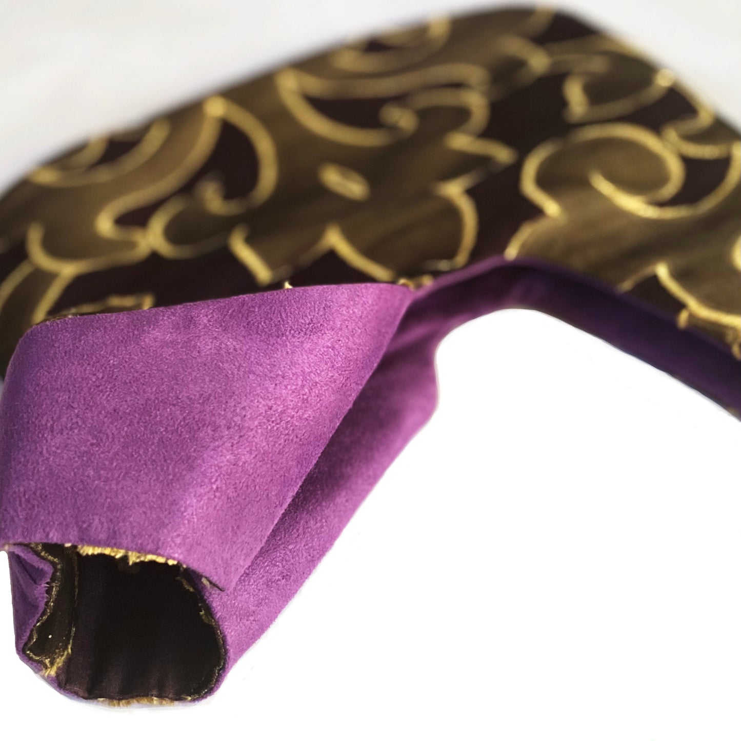 The simple shape of the bag perfectly balances and emphasizes the beautiful burnout sheer textile fabric. The inside is lined with a luxurious purple ultrasuede. The bag is large enough to accommodate most of your basic needs. Te Plus Te Archive.