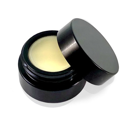 Black glass jar lid open and showing tepluste_hinokinoir_lipbalm hinoki pure essential oil organic vegan balm