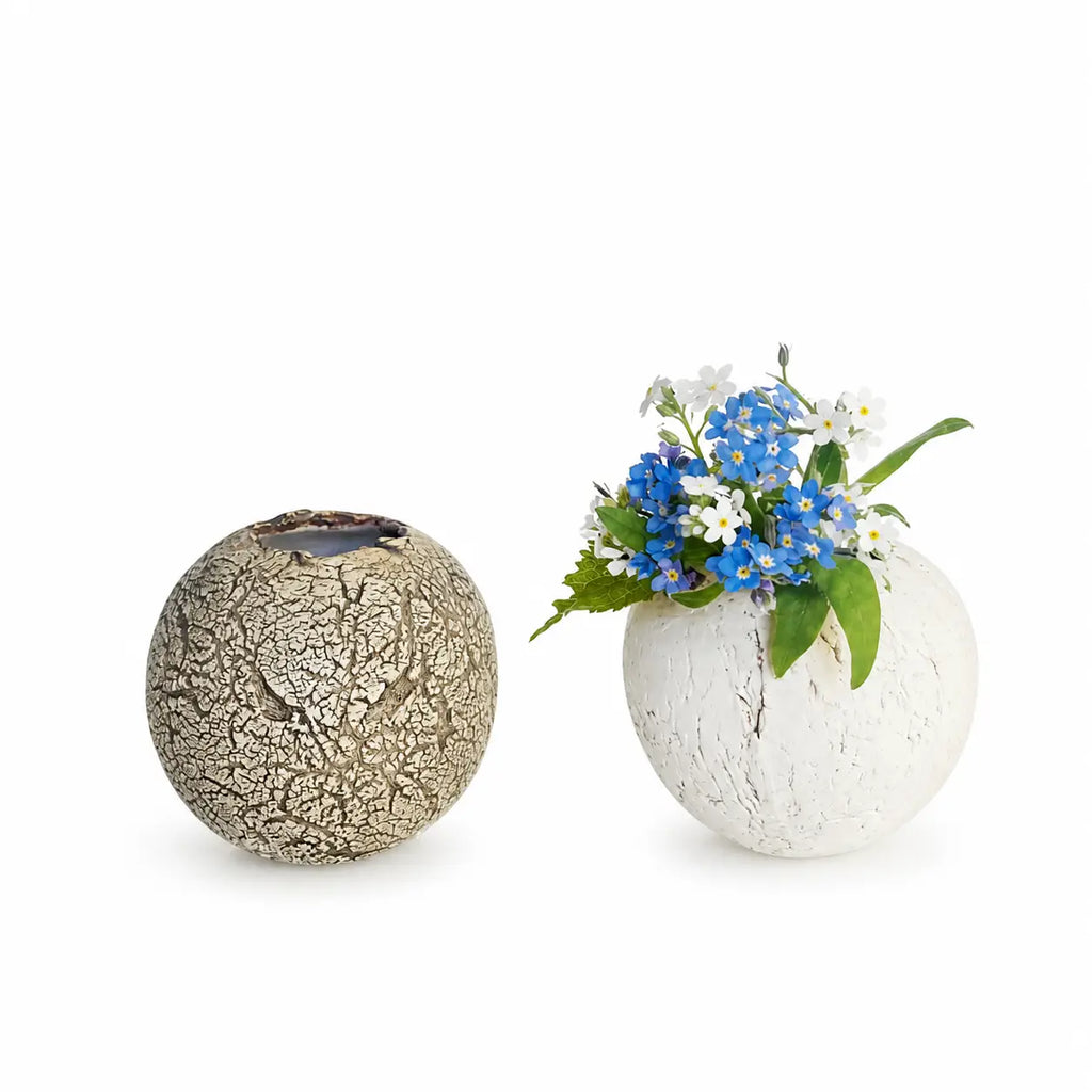 Two decorative vases on a white background, one with a cracked texture and the other with a natural stone finish.-TE PLUS TE