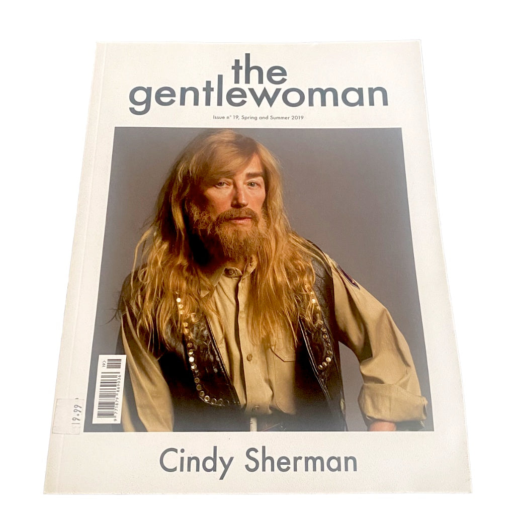Magazine cover featuring Cindy Sherman with a long beard and leather jacket.