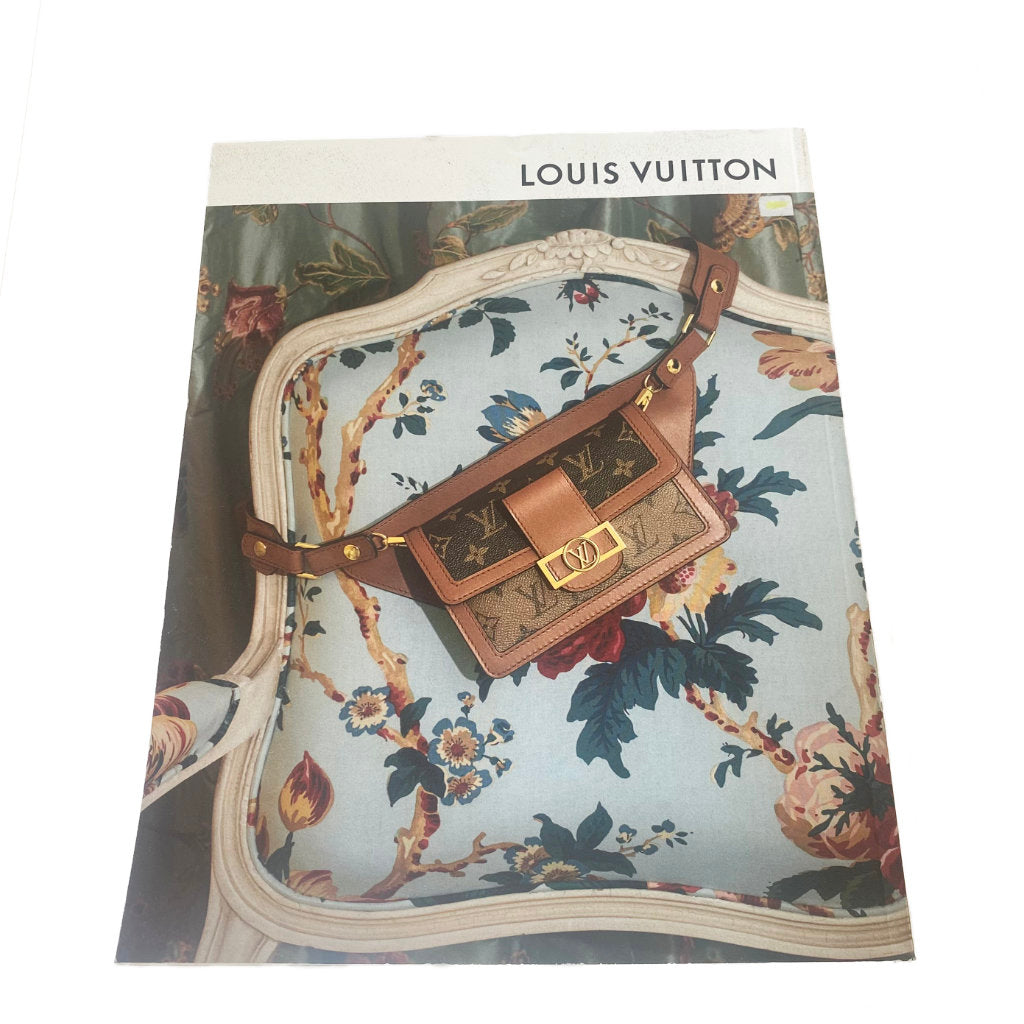 Louis Vuitton handbag on a floral-patterned background