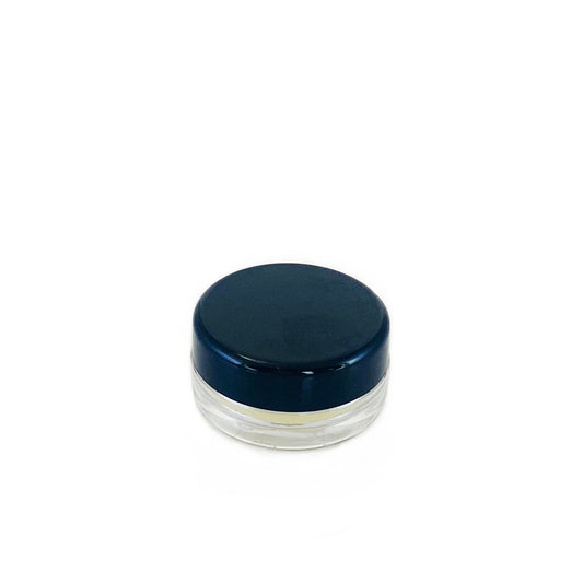 Small clear container with a dark blue lid on a white background