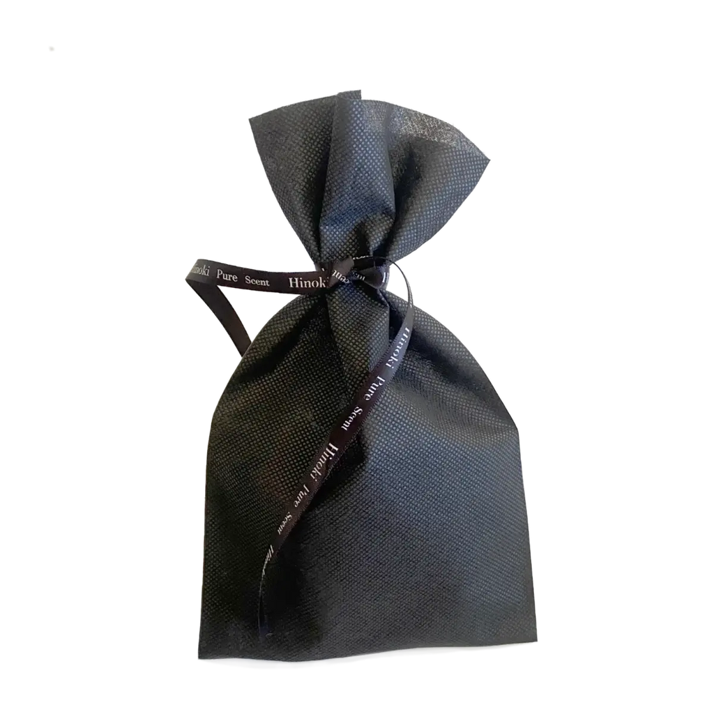 Hinoki Noir & Noir Red Discovery Set in a black gift bag tied with a Hinoki Pure Scent ribbon — TE PLUS TE