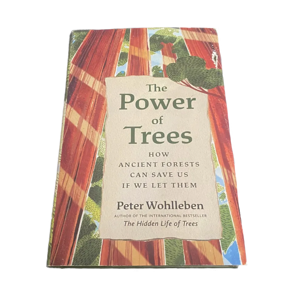 Book titled 'The Power of Trees' by Peter Wohlleben with tree imagery on the cover.