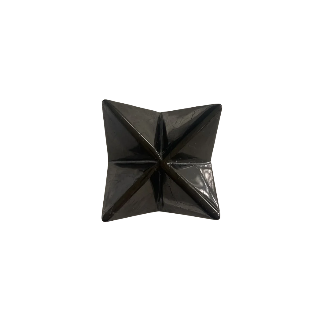 A glossy black, four-pointed star-shaped decorative object or container, photographed from directly above on a solid white background.