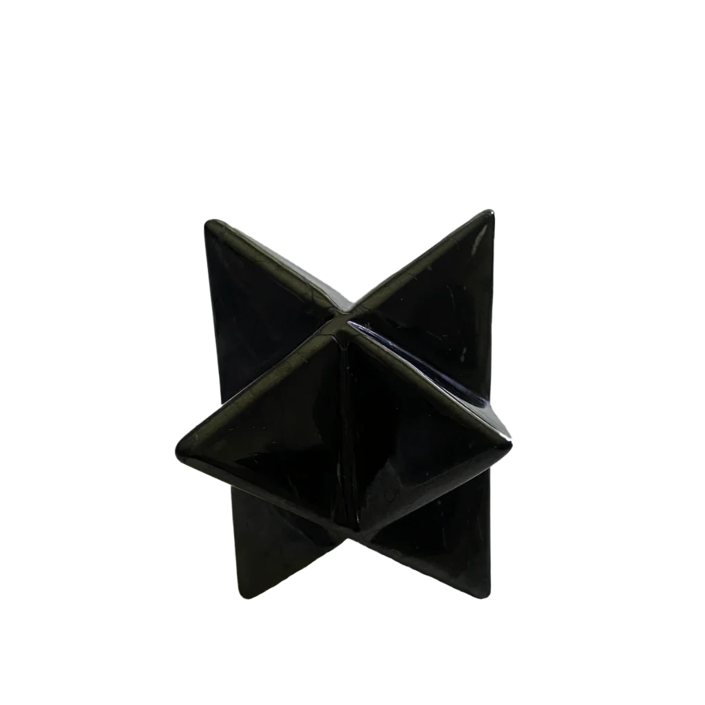 A black polished stone pyrite star, also known as a metallic star or selenite star, photographed on a seamless white background.