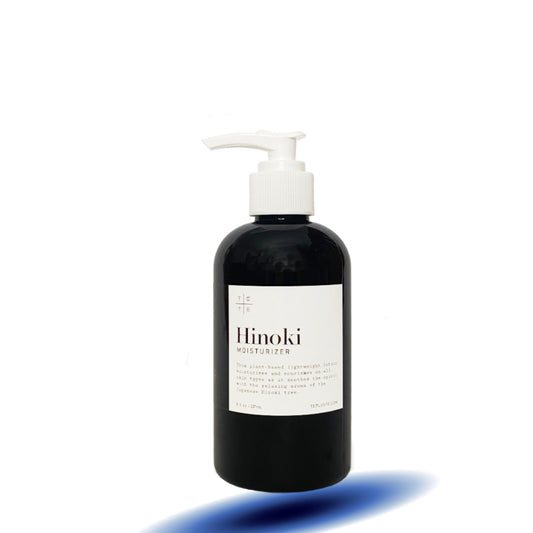 Black bottle with white pump and label on a white background