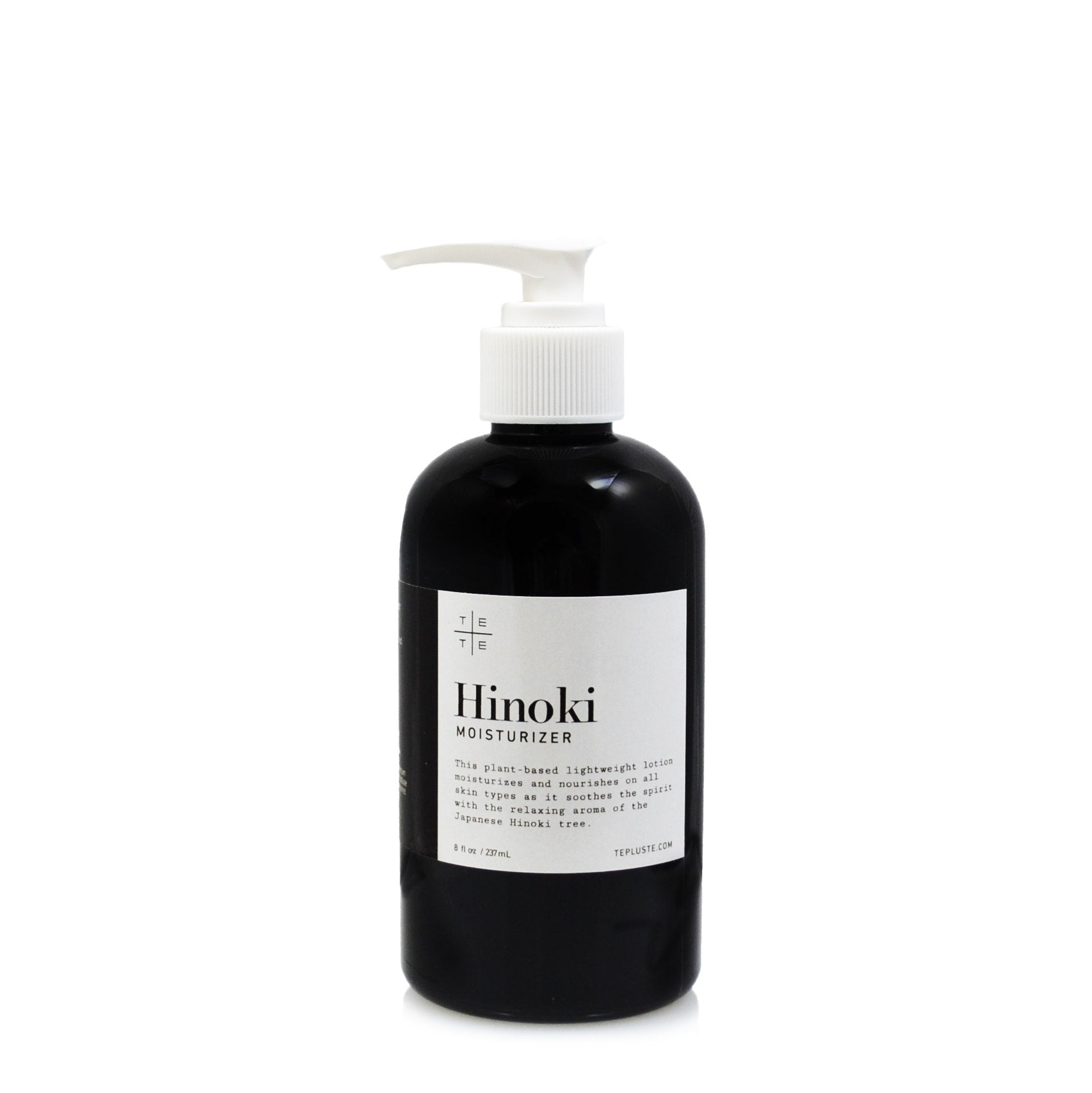 Black bottle of Hinoki moisturizer with a white label on a white background