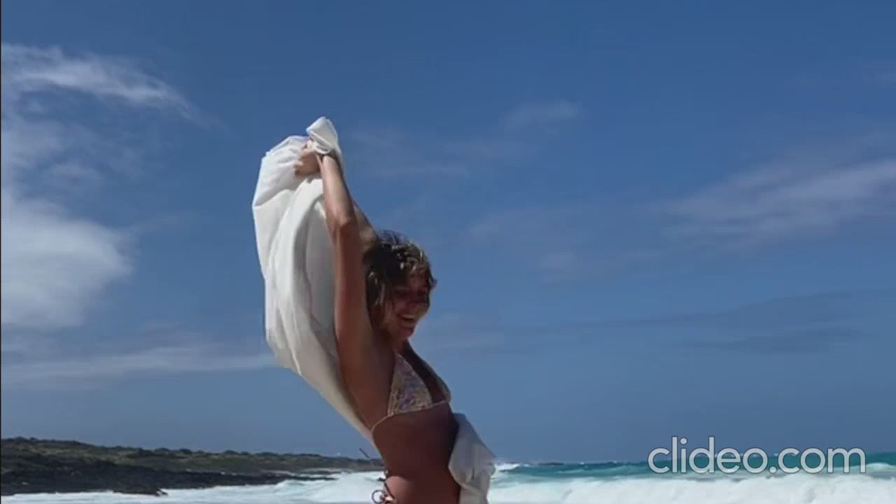 Cinematic movement of a large natural white Japanese super towel waving against a clear blue sky — TE PLUS TE