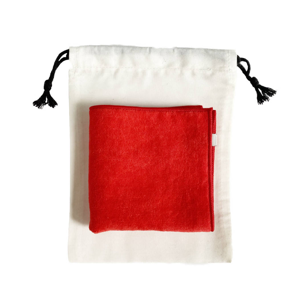 Red Mini Towel Made in Japan folded on bag — TE PLUS TE
