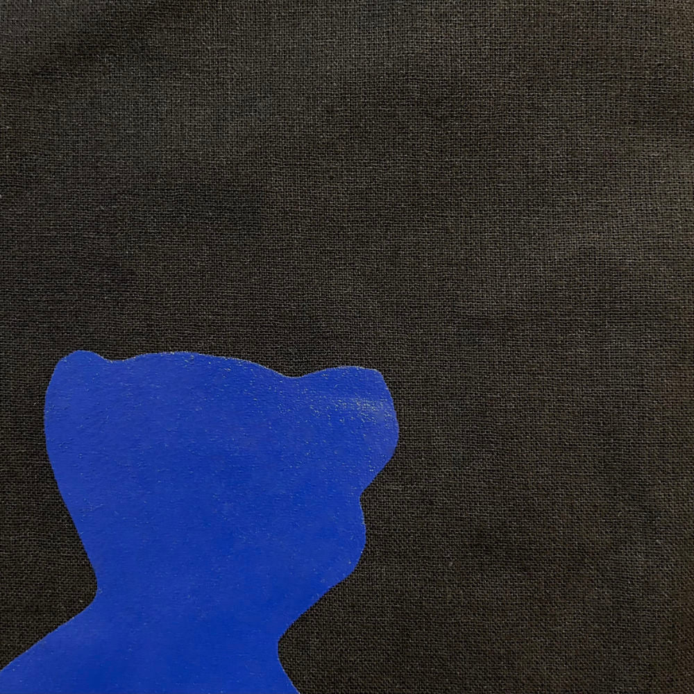 Close-up of Black tote bag with blue  bear shaped motif designed by Danish mixed media artist Per Skovgaard Based in Copenhagen
